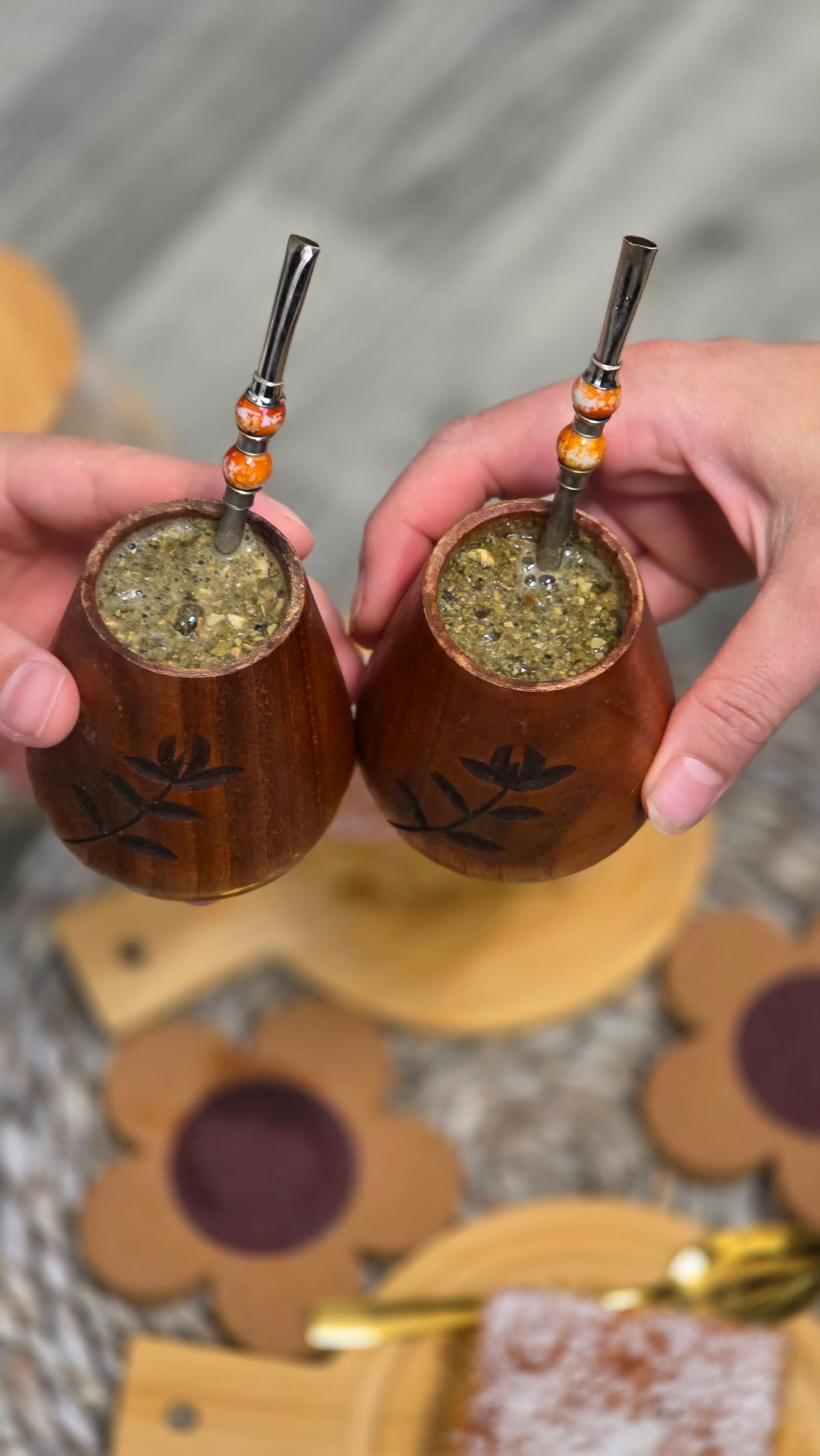 Two mate gourds raised in a toast
